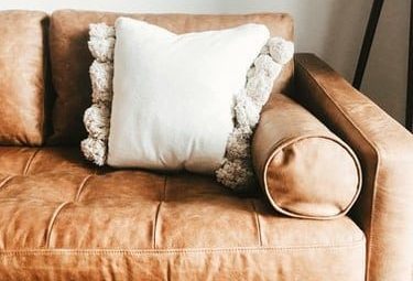 The Best Pillow Color for a Dark Brown Couch